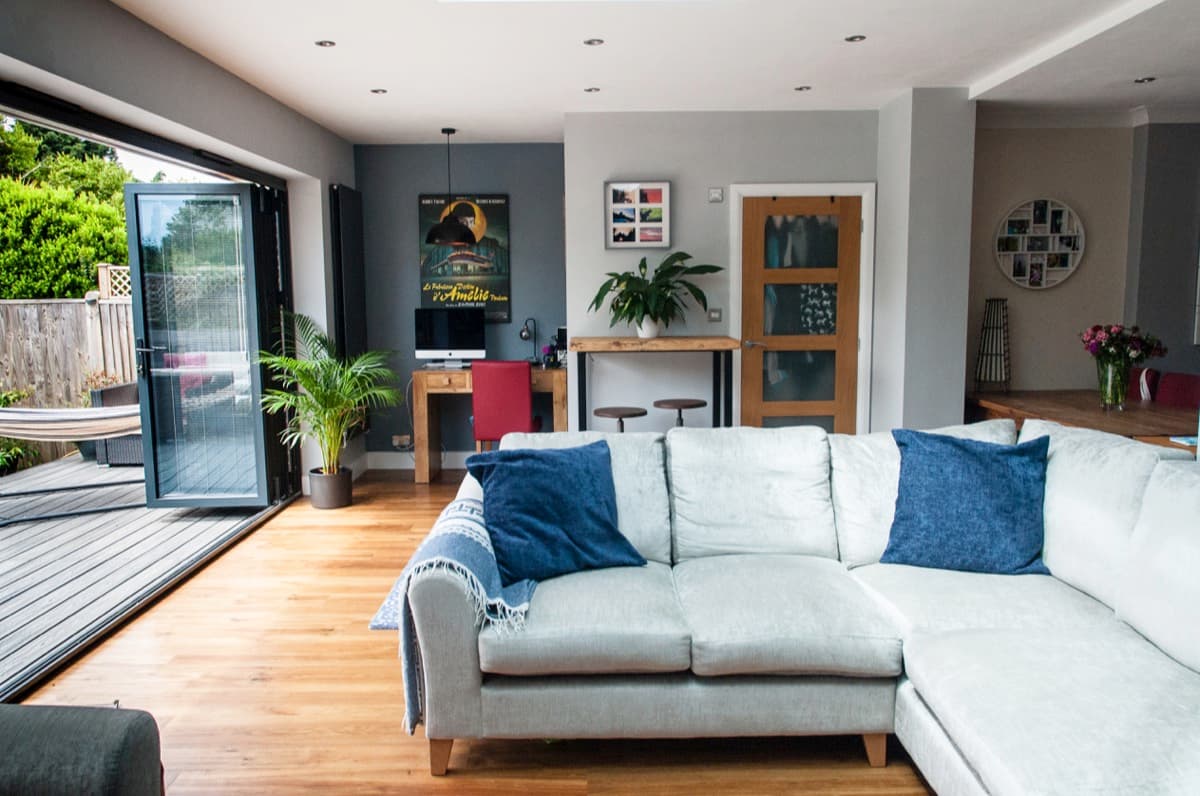 Renovated open-plan living space with bi-fold doors